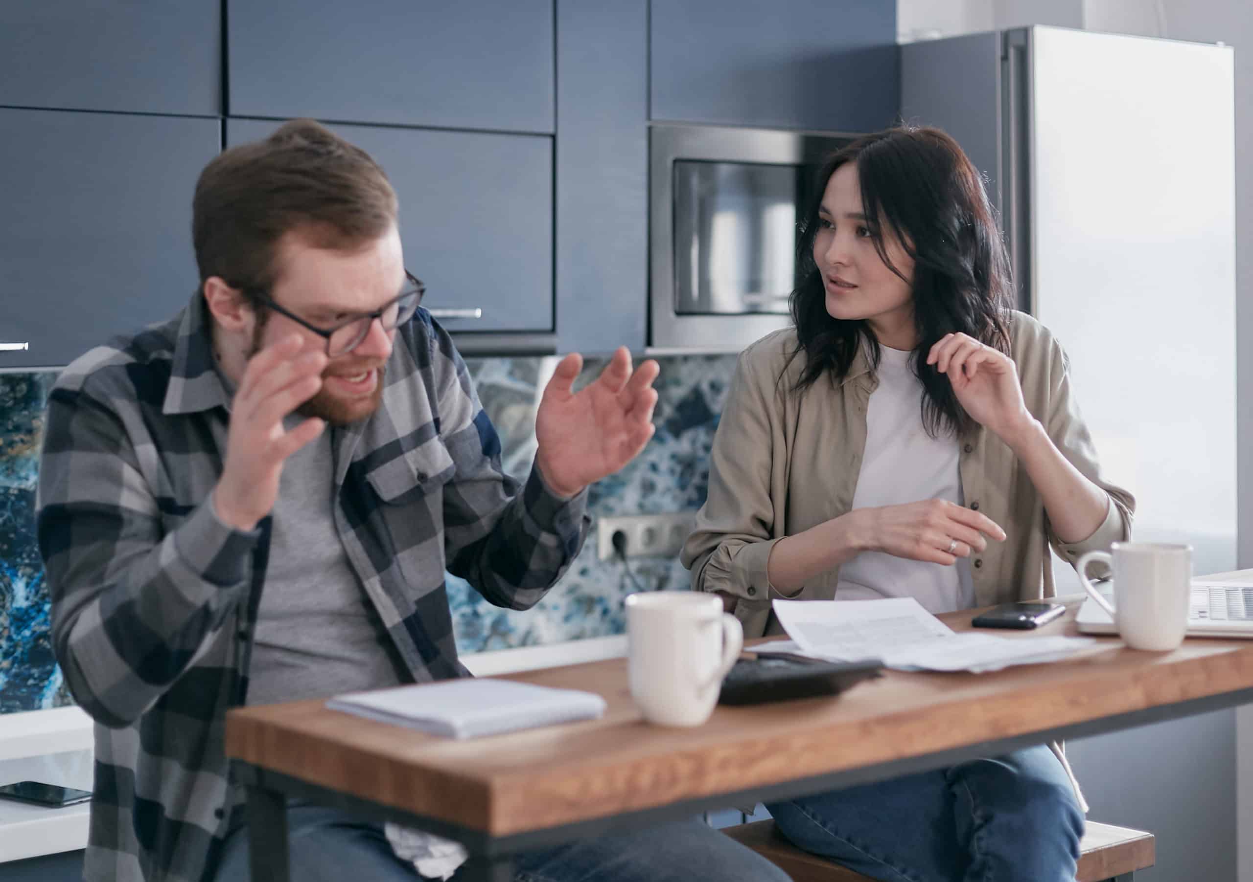 Anxious man talking to a woman sitting beside him