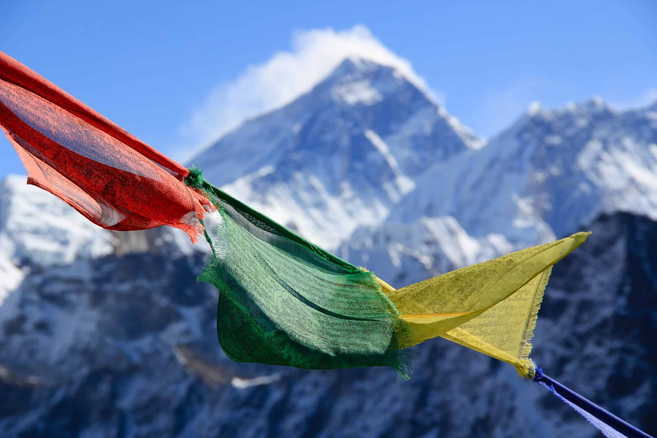 Standing on the peak and summit of Gokyo Ri in Nepal overlooking the massive Khumbu Valley and Mount Everest, Chomolungma.