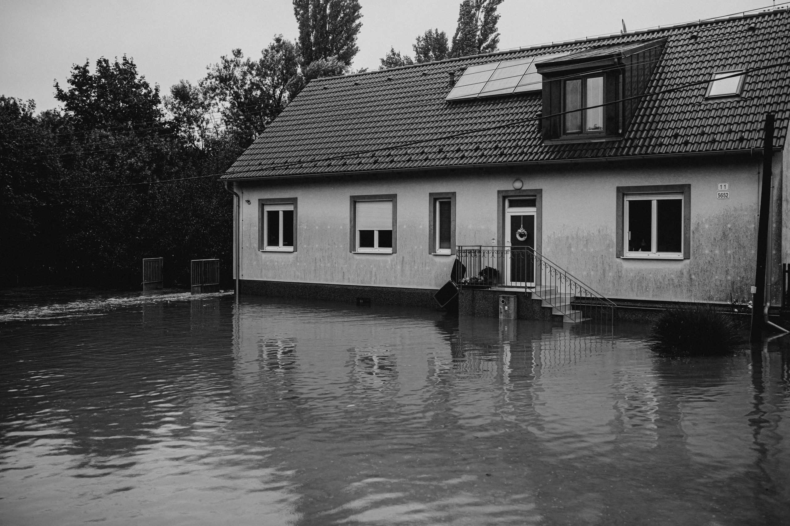 Flooded suburban house in monochrome